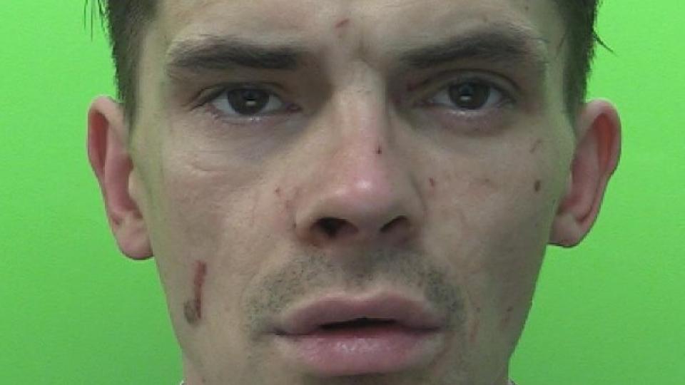 Image of Jamie Murr in front of a green screen