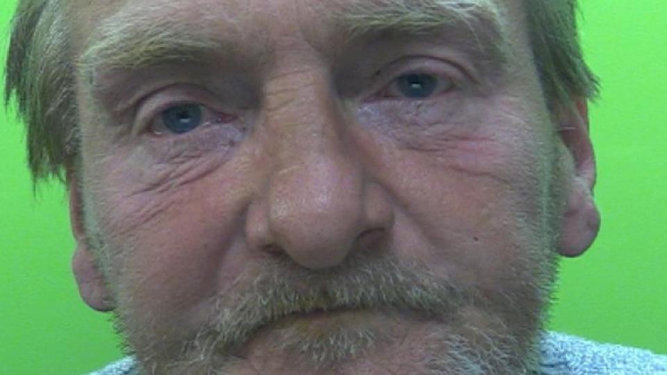 Mug shot of Graham Watson stood in front of a green screen. 